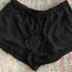 Cute black shorts with lace underlay, tassel tie!